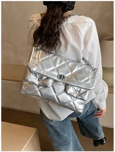 Silver quilted chain bag with metallic finish and metal twist lock in a stylish large size
