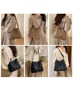 Gros plan du sac seau en cuir texturé avec détails métalliques dorés et bandoulière chic