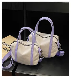 Detail of minimalist cream canvas tote bags with lavender straps in two sizes