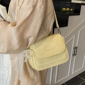 Minimalist cream shoulder bag with crinkled texture and stylish lace pearl charm decoration
