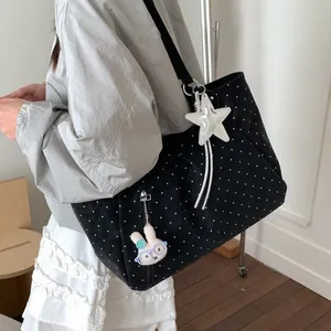 Black polka dot canvas tote bag with star and bunny charms for daily commuting