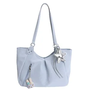 Large light blue polka dot tote bag with cute rabbit charm and silver star pendant
