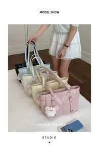 Detailed close-up of fashion tote bags in five colors with cute bear plush charms