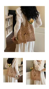 Close-up of large floral crochet pattern and tassel drawstring on the woven tote bag