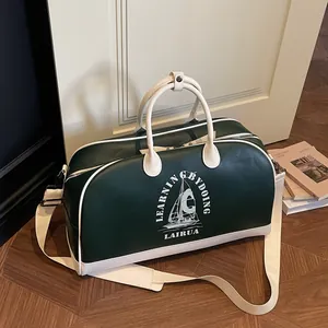 Bolso de viaje retro verde y crema con estampado de velero y correa ancha de hombro
