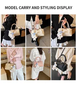 Three elegant Boston handbags in cream, pink, and black featuring plush bear charms
