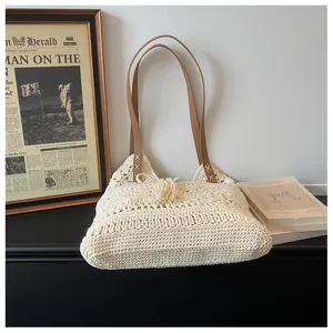 Detail of hand-woven cotton tote featuring hollow texture and premium leather strap