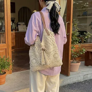 Large cotton crochet tote bag with hollow pattern and brown leather straps for beach