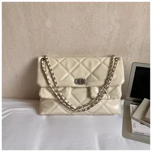 Detailed view of quilted faux leather texture and dual front pockets with twist-lock buckles