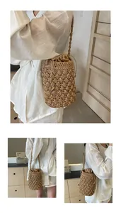 Detailed view of handmade straw bucket bag with floral texture and drawstring liner