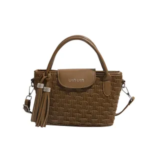 Brown water-ripple bucket bag with VINVIN logo and sparkling rhinestone tassel pendant