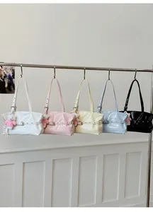 Multiple color options of minimalist glossy tote bags with cute teddy bear pendants