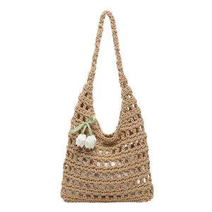 Handmade hollow crochet tote bag with tulip pendant and ribbon detail in khaki finish
