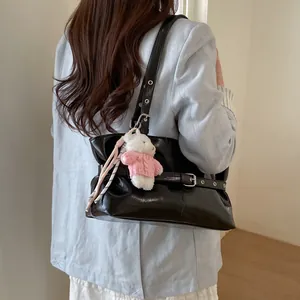 Black glossy PU leather tote bag with silver buckles and a cute white teddy bear charm