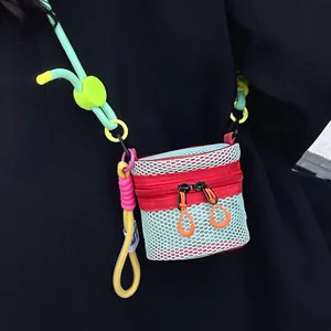 Mini mint green mesh crossbody bag with colorful rope strap in dopamine fashion style