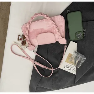 Pink vintage square bag featuring gradient texture, woven handle, and decorative accessories