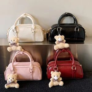 Boston handbags set in shiny pleated leather with cute bear charms in four colors