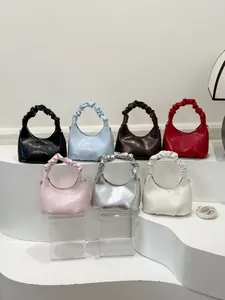 Hobo crescent bag collection in seven colors with scrunchie handles and crossbody straps