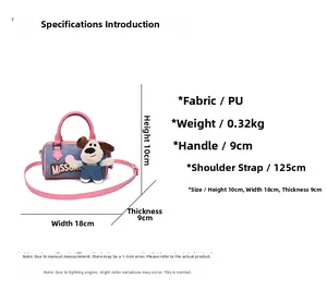 Detail view of denim and pink PU Boston bag with size specs and strap measurements