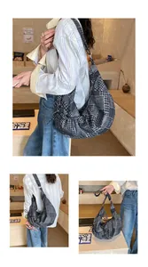 Detail of hobo bag with patchwork patterns including houndstooth, dots and stripes