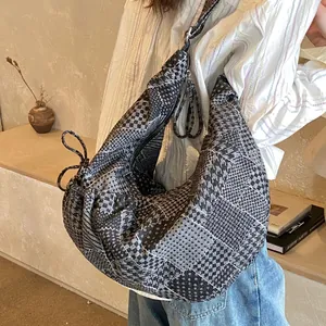 Large hobo shoulder bag in black and white checkered fabric with zipper closure