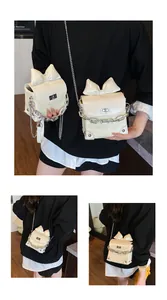 Close-up of cream bow shoulder bag featuring woven texture and silver twist lock