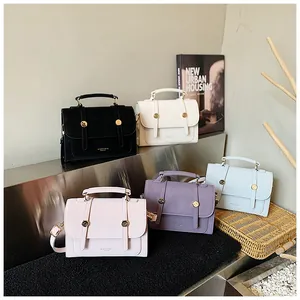 Detailed display of vintage square handbags in five colors with golden metal buckles