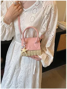 Close-up of pink leather and woven straw mini bag with starfish charm and shoulder strap