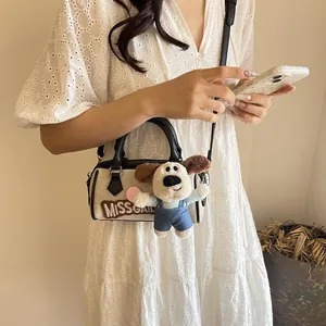 Mini Boston bag with MISS GAIL embroidery and plush toy charm, beige and black