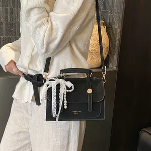 Vintage black crossbody square bag with lace pearl bow charm and matte leather finish