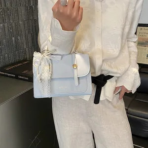 Light blue square handbag with gold buckle, white lace bow and pearl charms for women