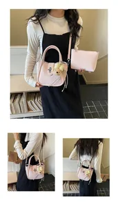 Pink lychee texture bucket bag with metal chain strap and plush bear accessory