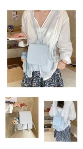 Light blue PU leather backpack with drawstring closure and cute plaid bear keychain detail