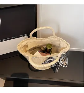 Interior view of woven straw tote bag showing spacious capacity and inner pocket