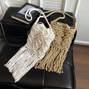 Handmade bohemian macrame tassel straw bag with drawstring lining for beach vacations
