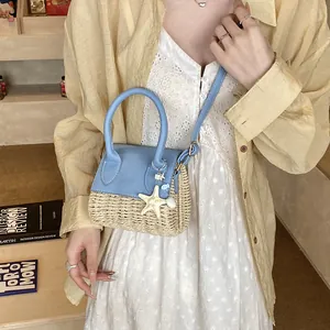 Mini sky blue straw woven crossbody bag with starfish charm and top handle for summer