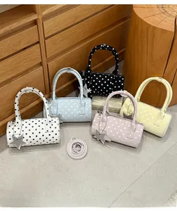 Polka dot cylinder handbags in multiple colors with star charms and detachable straps