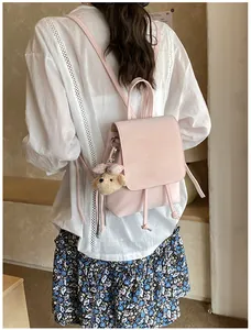 Pale pink PU leather mini backpack with drawstring and cute plush bear charm detail
