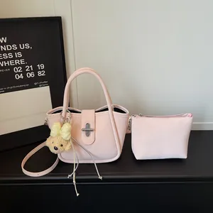 Pink lychee grain bucket bag set with cute bear charm and rotating metal clasp