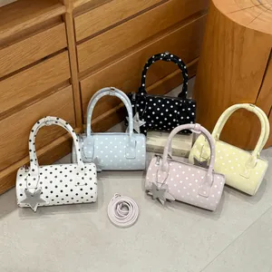 Polka dot bowling bag in five colors with star pendant and crossbody strap