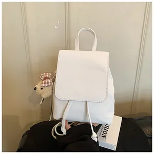 White mini PU leather backpack with drawstring closure and cute teddy bear charm