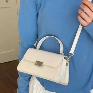 Minimalist white faux leather handbag with silver lock and detachable shoulder strap