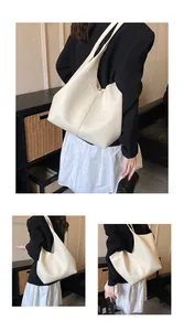 Three-way view of a cream large hobo shoulder bag featuring pebble grain leather texture