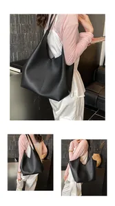 Close-up of black lychee-textured leather on a spacious hobo tote bag for daily commute