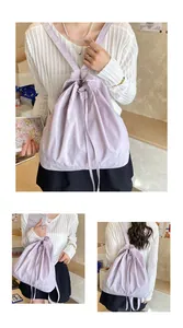 Detail view of the lavender drawstring backpack with adjustable thin shoulder straps