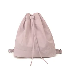 Close-up of lavender purple drawstring backpack with metallic eyelets and durable nylon texture