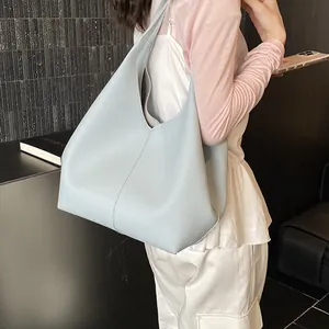 Light blue large capacity hobo bag in lychee pattern leather for shoulder wear