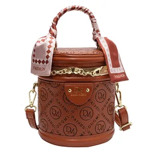Retro brown PU round crossbody bag with embossed logo and silk scarf handle detail