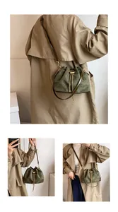 Deep green suede bucket bag with gold chain drawstring shown in three styling views