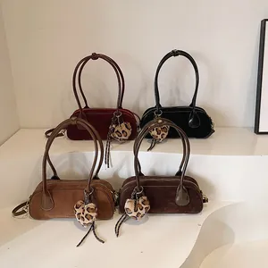 Retro suede hobo bags in four colors with leopard heart charms and dual handles